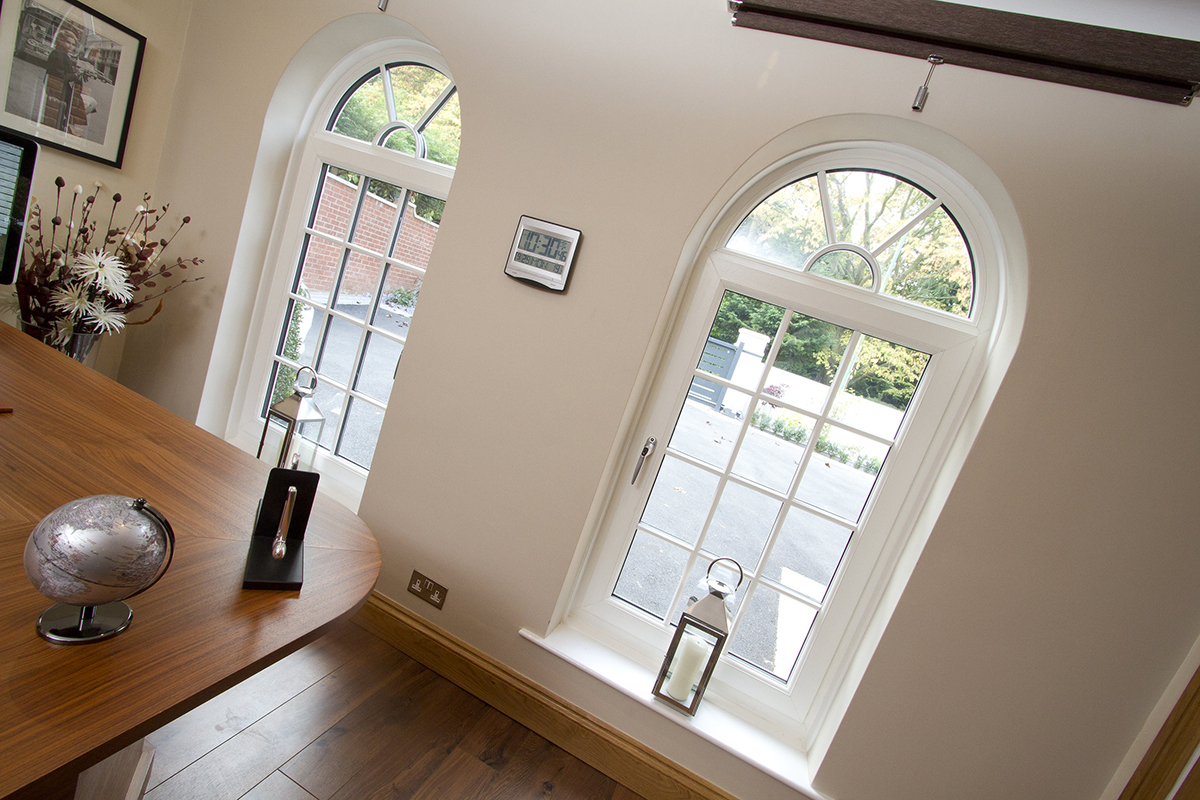 Arch window replacement Redditch photo from inside dining room looking through windows to the garden