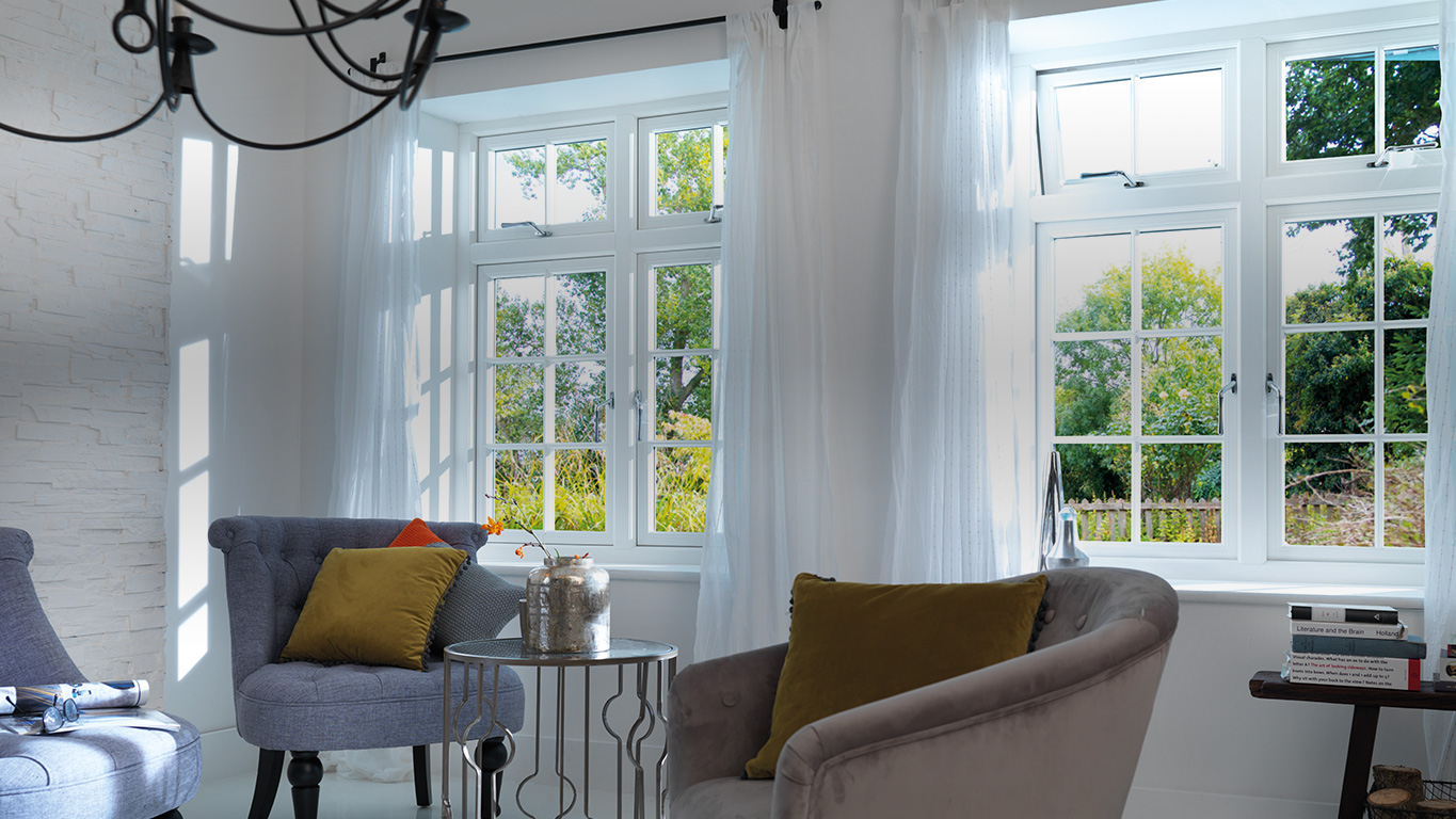 Living room with large replacement windows and armchairs