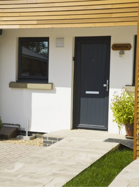 black composite doors Droitwich Spa with paved path