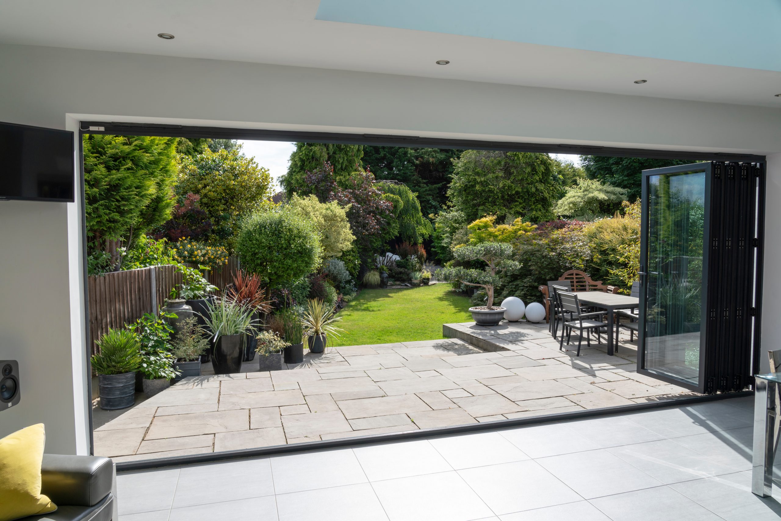 open bifold patio doors Redditch leading to patio and garden